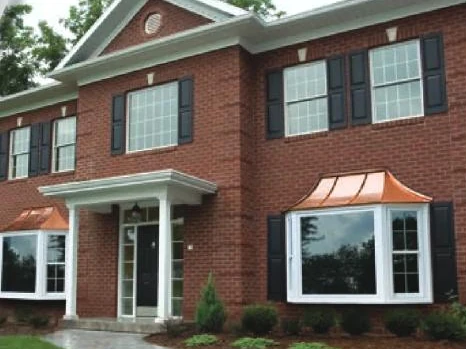 Brick home with replacement double hung and bay windows installed