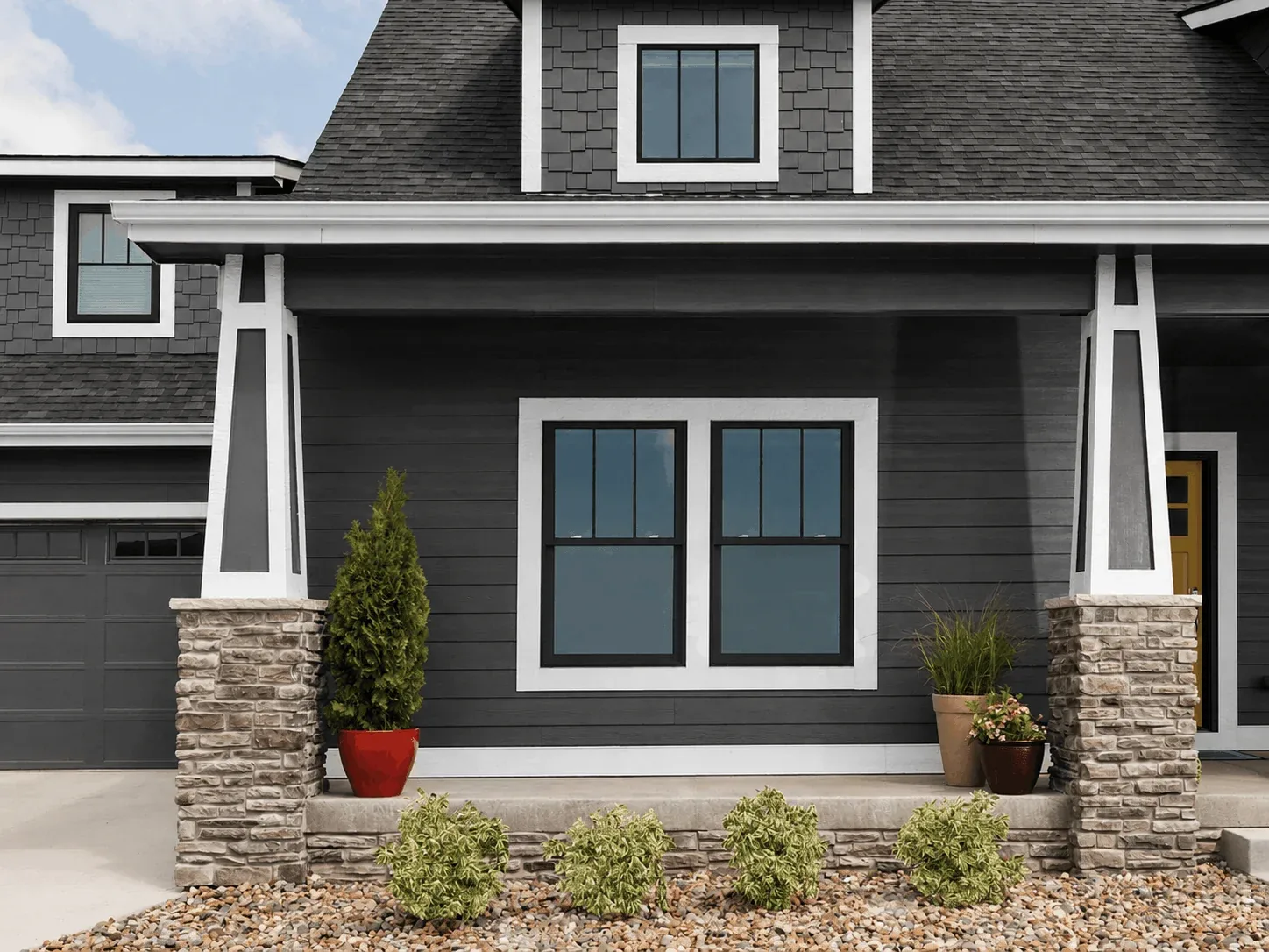Double-hung vinyl windows on a home exterior